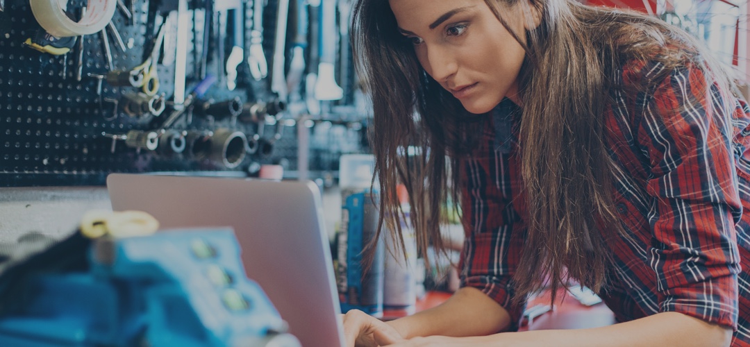 female mechanic with laptop