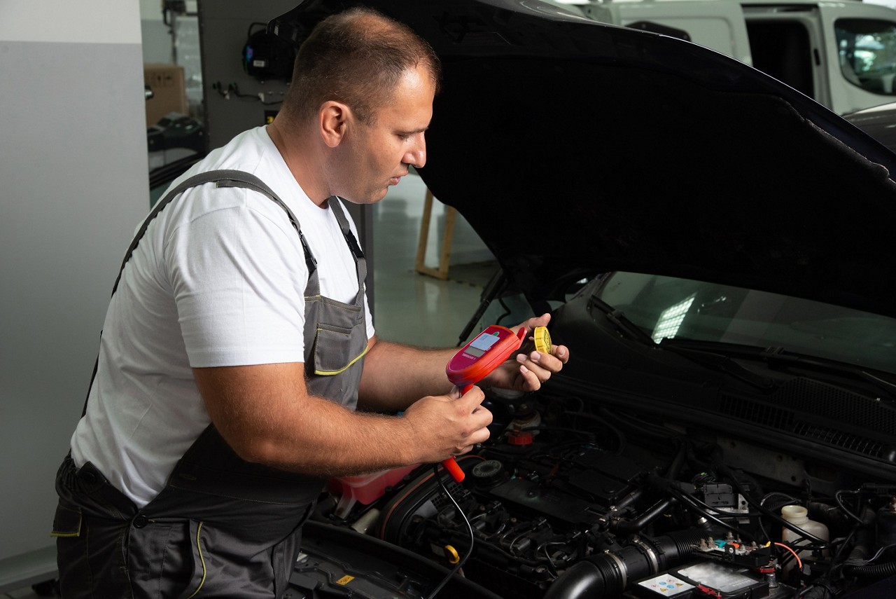 mechanic using diagnostics tools